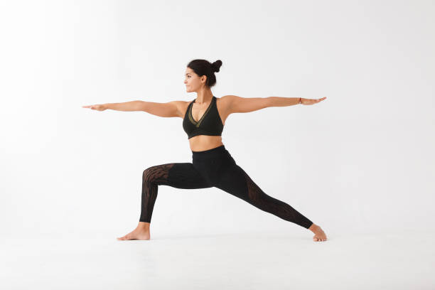istock Beautiful young woman doing yoga 946566770