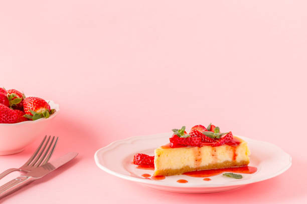 istock homemade cheesecake with strawberries on pink background 946566846