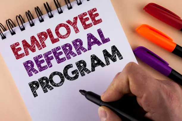 Photo of Word writing text Employee Referral Program. Business concept for Recommend right jobseeker share vacant job post written by Man with Marker on Notepad on the plain background Markers next to it