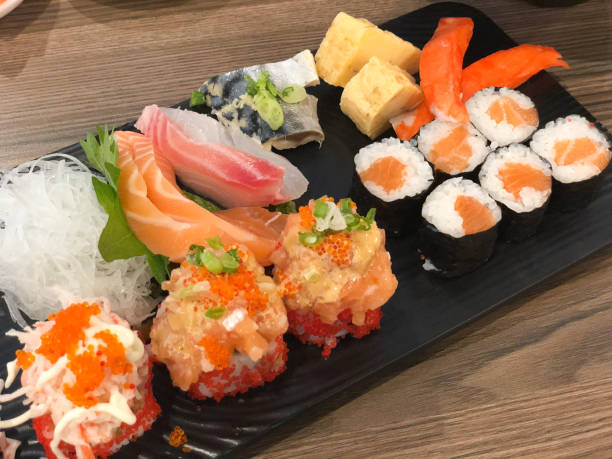 istock Mixed sliced fish sashimi and mix sushi set japan food 946573314