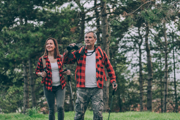 istock Father and daughter trail hiking on high mountain 946581036