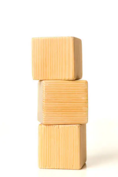 3 wooden blocks stack on white background