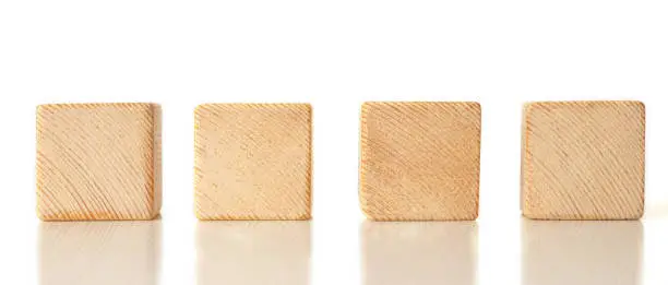4 wooden cubes on white background