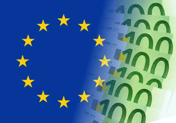 eu flag with 100 euro banknotes
