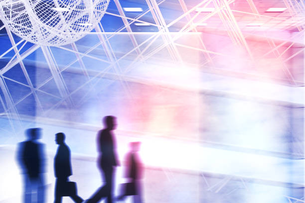 istock Blurry businesspeople silhouettes in city 946586372