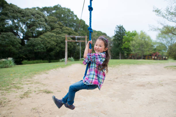 istock Little girl playing in the park 946604856