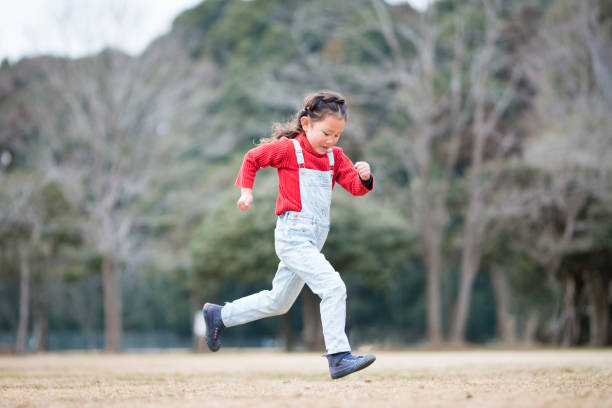 istock Little girl playing in the park 946607174
