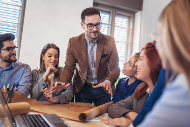istock Business people working in office together. Team work in office. 946607204