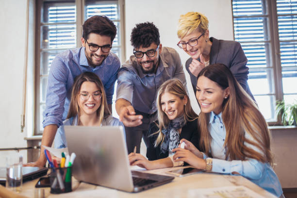istock Business people working in office together. Team work in office. 946610416