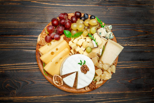 istock various types of cheese on wooden cutting board 946617446