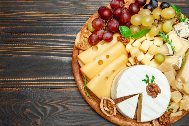 istock various types of cheese on wooden cutting board 946617466