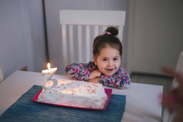 istock Cute girl celebrating her third birthday 946618184