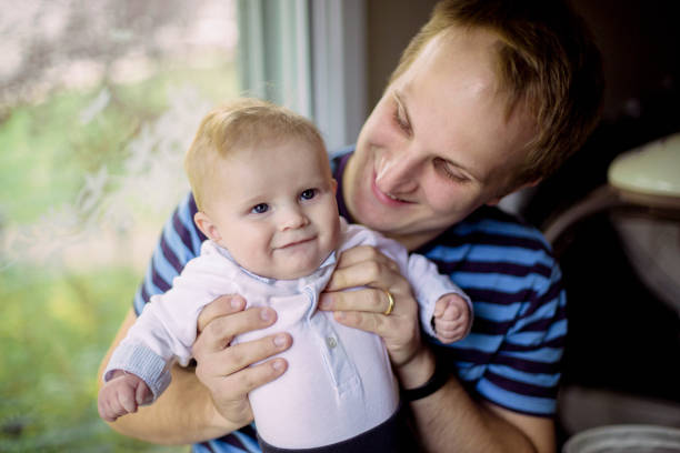 istock Father holding his baby boy 946621534