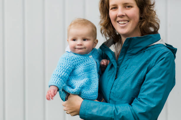 istock Mother holding her baby boy 946624718