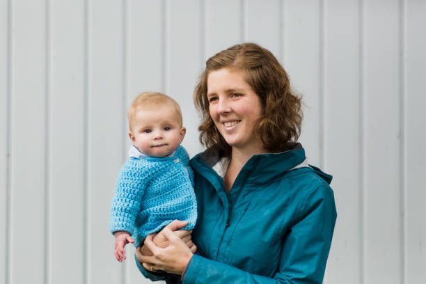 istock Mother holding her baby boy 946624744