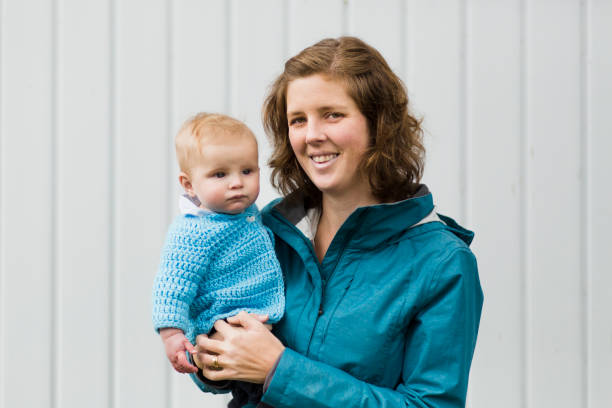 istock Mother holding her baby boy 946624768