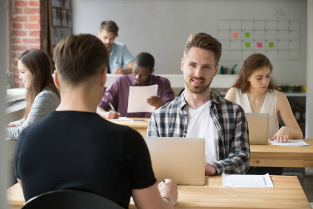 istock Male student happily looking at camera after exam 946637026
