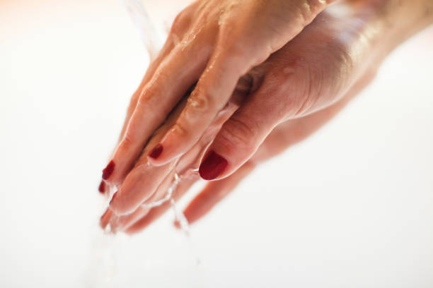 istock Close-Up Of Washing Hands 946637374