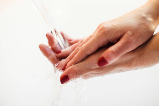 istock Close-Up Of Washing Hands 946637378
