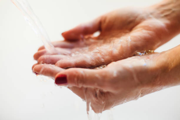 istock Close-Up Of Washing Hands 946637382