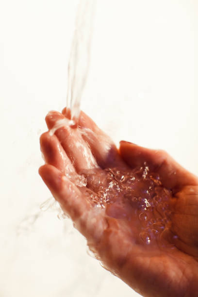 istock Close-Up Of Washing Hands 946637422