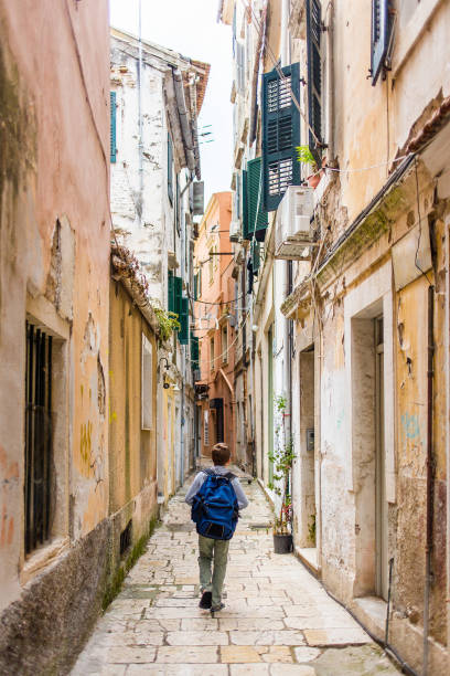 istock Boy Walking in Urban Alley 946640108