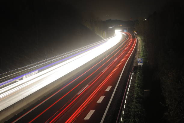istock Light Trails of Vehicles on Highway Travelling at Night 946640528