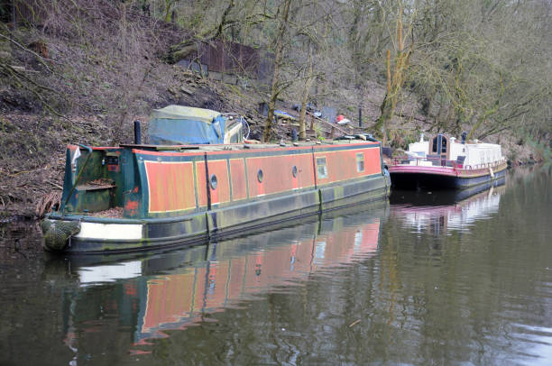 istock old rusty abandoned narrowboat or converted barge moored on a canal 946640720