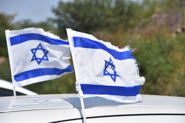 istock Israeli flags on a vehicle 946641446