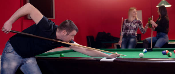 istock Panorama of a man playing pool 946651290