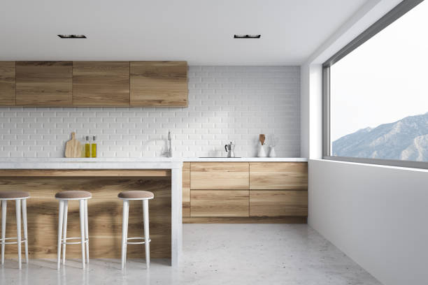 istock White brick kitchen interior, wooden bar 946651388