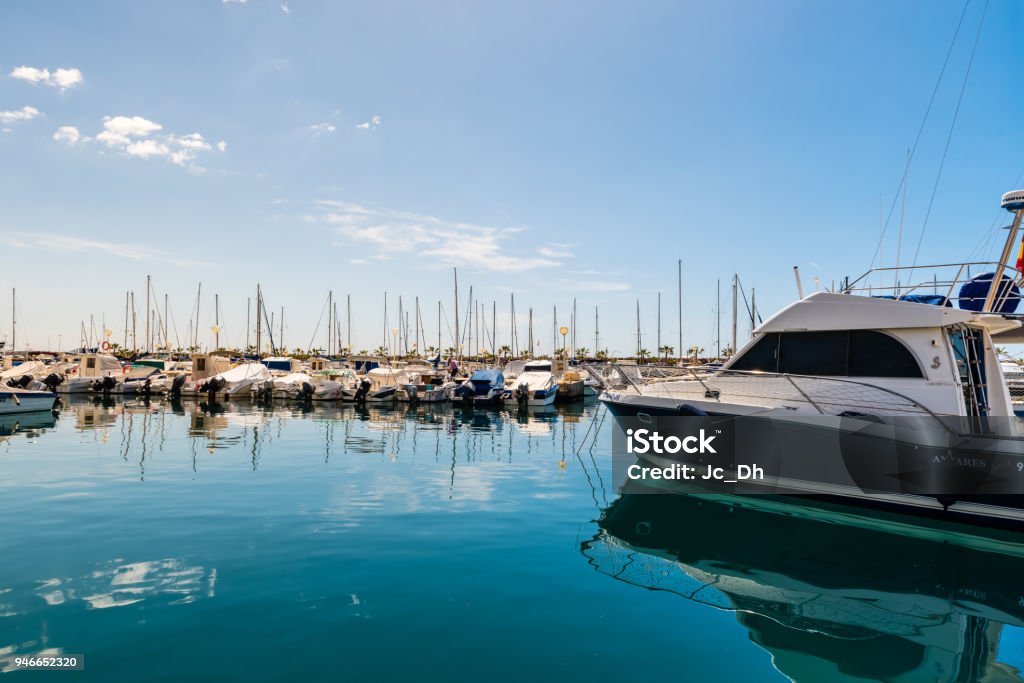recreational boat moored in marina Blue Stock Photo