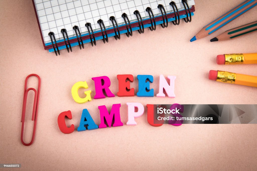 Green Campus. Wooden letters on the office desk Green Campus. Wooden letters on the office desk, informative and communication background Beauty Stock Photo