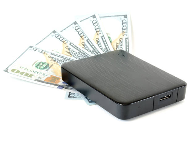 istock Portable drive USB on dollars pile for data is money concept 946658450