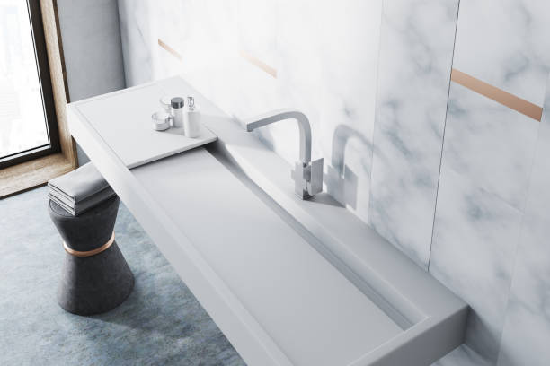 istock Marble bathroom, white sink top view 946658628