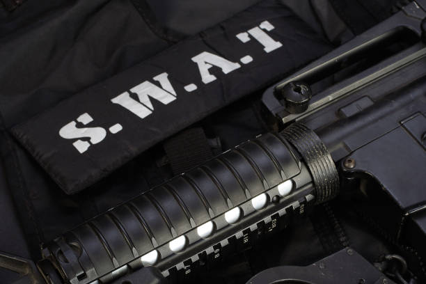 istock Special weapons and tactics team equipment on black background 946661816