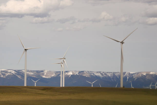 istock A Wind Farm with Rugged Mountains in the Background 946662058