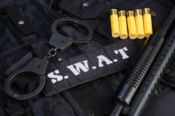 istock Special weapons and tactics team equipment on black background 946662158