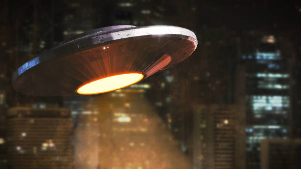 istock UFO, science fiction scene, alien spaceship from outer space hovering in front of city skyline, extraterrestrial visitors 946669930