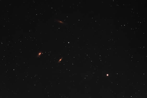 Leo Triplet The three spiral galaxies M65, M66, and the Hamburger Galaxy NGC 3628 forming the M66 Group, the Leo Triplet, in the constellation Leo as seen from Mannheim in Germany. mannheim photos stock pictures, royalty-free photos & images