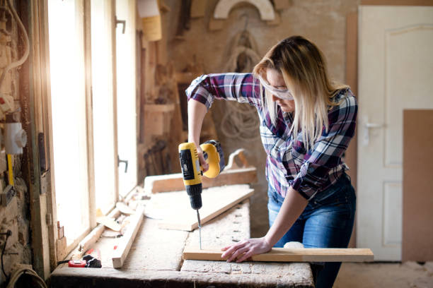 istock Young woman is screwing screws 946675744