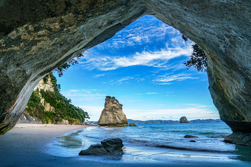 view from the cave at cathedral cove beach,coromandel,new zealand