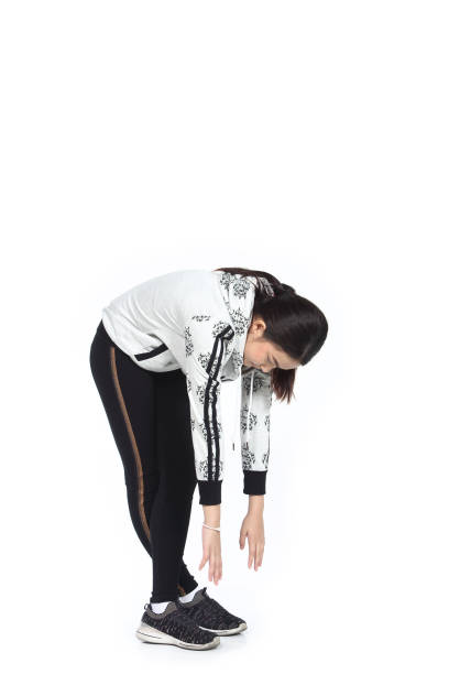 istock Little Girl warm up exercise in white background studio lighting 946719428