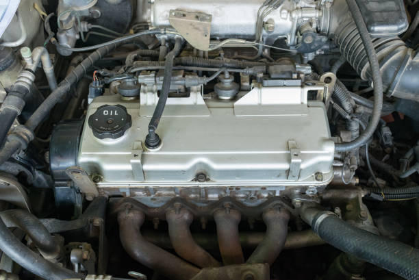 istock Maintenance a engine car with oil 946719540