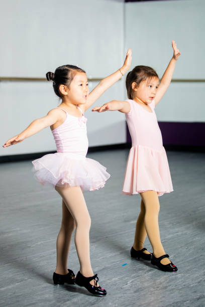 Little Girls Dancing in Studio Little girls dancing at a performing arts studio jazz dancing stock pictures, royalty-free photos & images