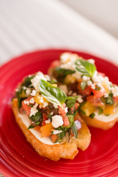 istock Bruschetta with Heirloom Tomatoes, Fresh Basil & Cheese 946728858