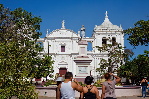 Leon, Nicaragua - March 31, 2018. People approach and look at the Catedral de la Asunción.