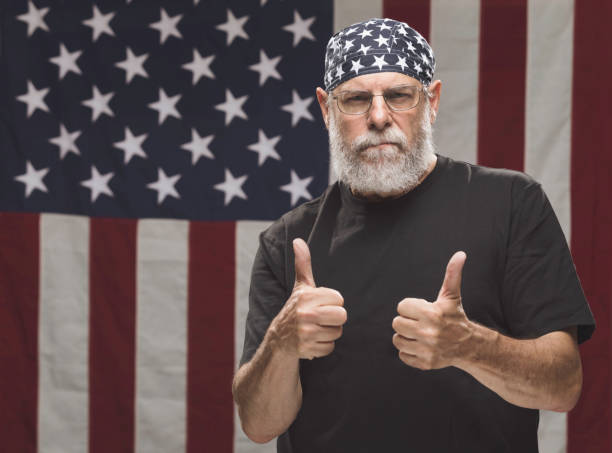 istock Authentic Vietnam Veteran with American Flag 946734974