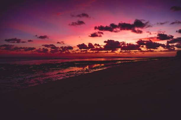 istock Bright colorful sunset or sunrise at ocean with clouds in Bali 946744564