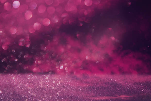 istock glitter vintage lights background. pink and purple. de focused. 946744858